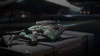 A03 Luckbringer on crate in hangar - Cropped.png